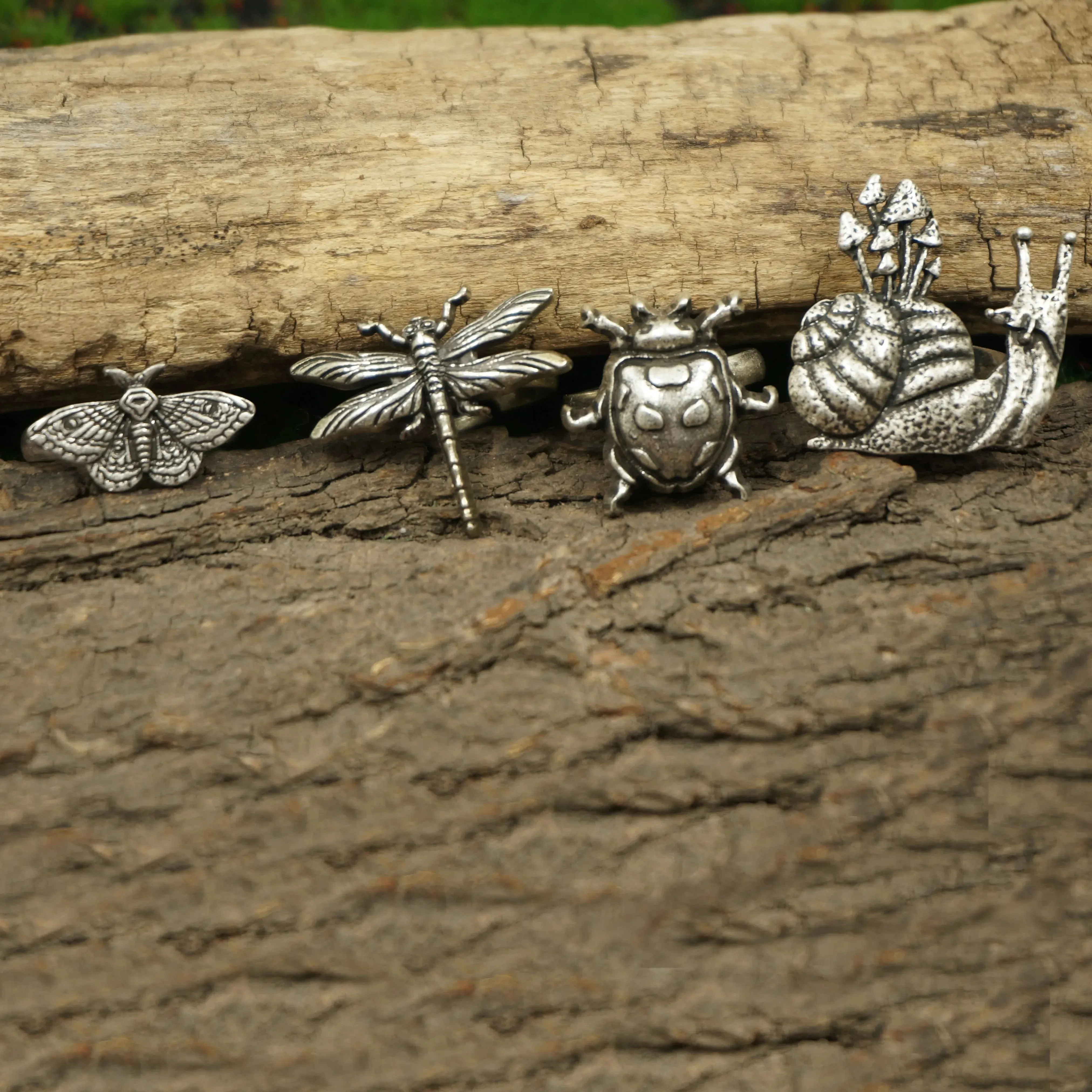 A set of 4 Cute Critter Rings Dragonfly Mushroom Snail Ladybug Moth Rings